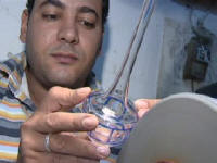 Blown glass being etched in Cairo Egypt  From Cairo with Love